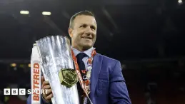 Willie Peters looking thoughtful at a rugby match.