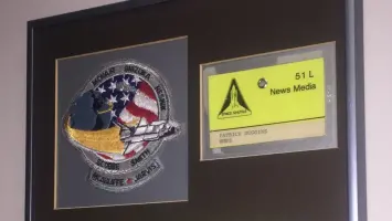 Close-up of two 'Remove Before Flight' tags from the Challenger shuttle