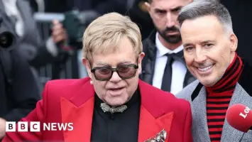 Elton John and David Furnish outside court