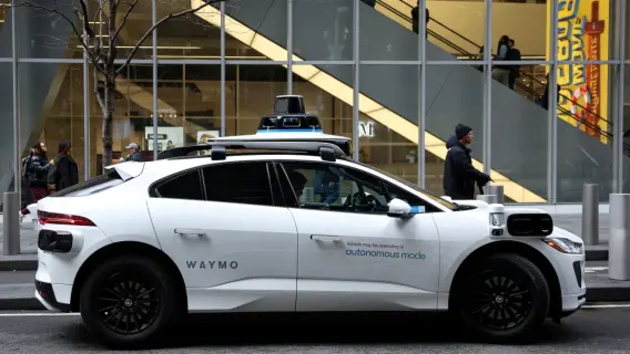 Waymo driverless taxi in London showcasing its autonomous technology