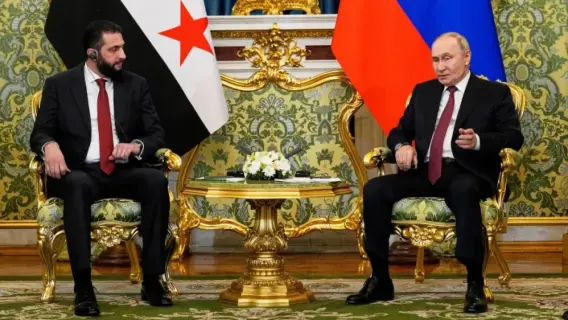 Vladimir Putin meeting Ahmed al-Sharaa at the Kremlin