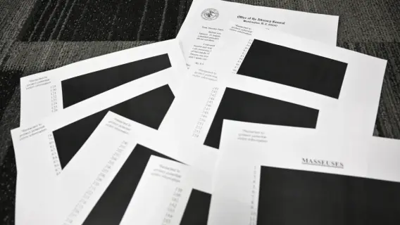 Stack of documents labeled Epstein File Release